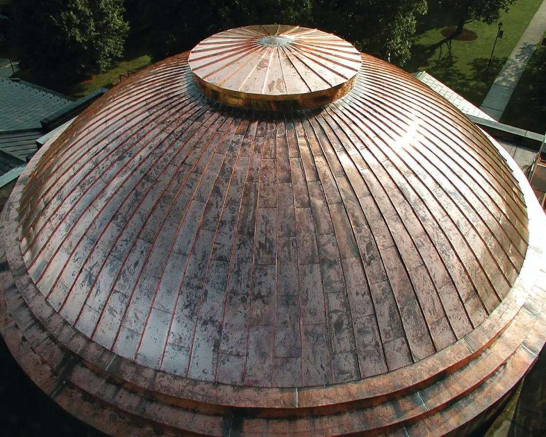 Craftsman Roofing crew installing a new roof in Essex Junction